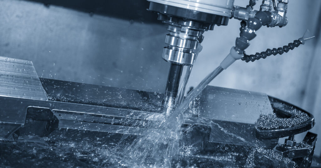 the cnc milling machine rough cutting the mold and die parts with liquid coolant method.