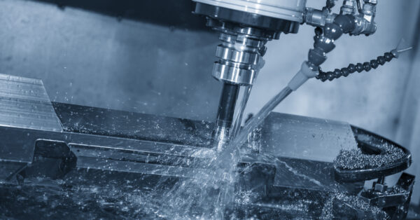 the cnc milling machine rough cutting the mold and die parts with liquid coolant method.