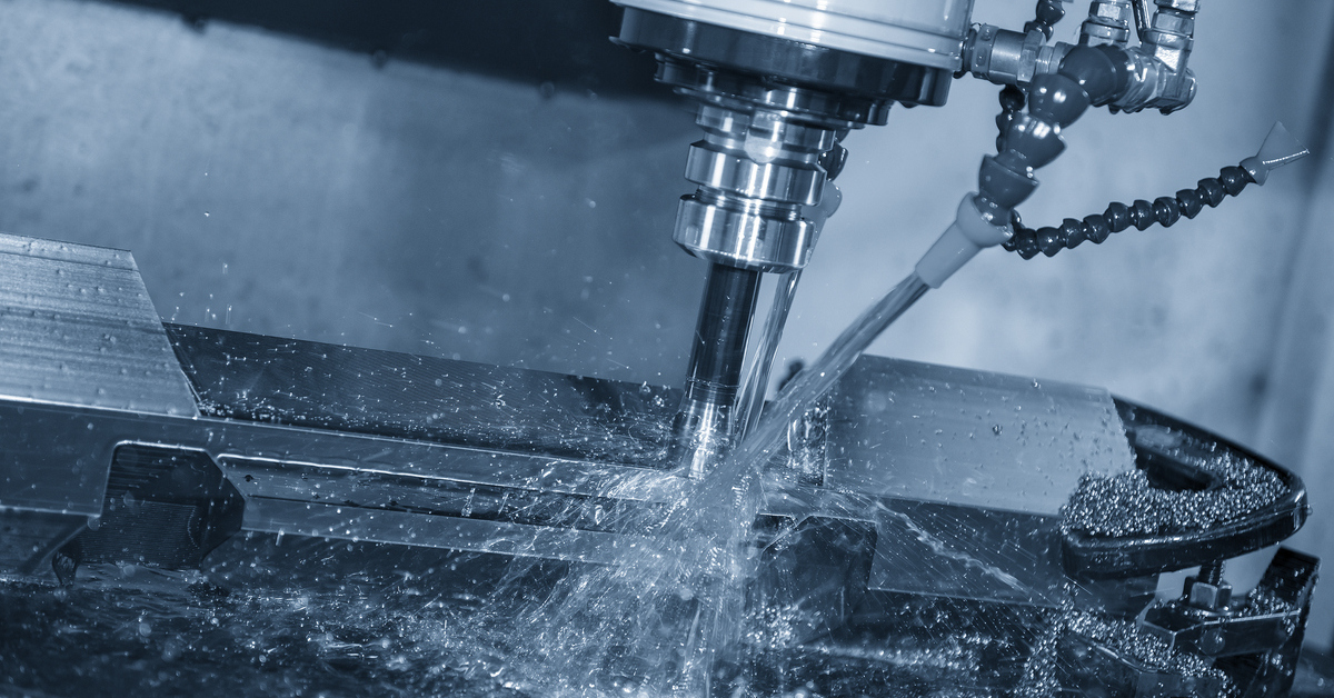 the cnc milling machine rough cutting the mold and die parts with liquid coolant method.